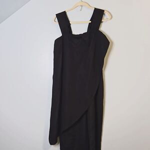 Black jumpsuit with a flowy overlay. Size M.